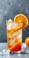 Refreshing citrus drink served over ice with a slice of orange and a vibrant color, perfect for summer gatherings photo