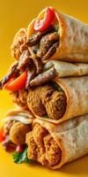 Deliciously stacked wraps filled with savory ingredients on a vibrant yellow background photo