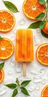 Colorful orange popsicle surrounded by fresh oranges and ice cubes on a white background photo