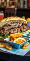 Savory sandwich with grilled meat and fries served with lemon slices at a vibrant restaurant photo