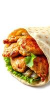 Grilled chicken wrap with fresh vegetables and herbs on a soft flatbread served for lunch photo