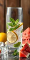 Refreshing summer drink with lemon, mint, and watermelon on a wooden table photo