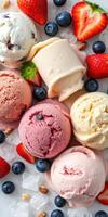 Ice cream assortment featuring various flavors and fresh fruits arranged on a cold surface photo
