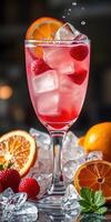 Refreshing fruit cocktail with strawberries and oranges served in a tall glass photo