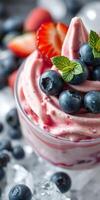 Delicious berry parfait topped with fresh blueberries and strawberries at a summer brunch photo