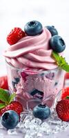 Delicious frozen yogurt with mixed berries served in a glass, perfect for refreshing summer days photo