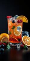 Refreshing summer cocktail with fresh fruit and mint against a dark background photo