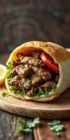 Savory grilled meat wrapped in warm flatbread with fresh vegetables and herbs served on wooden board photo