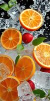 Refreshing citrus fruit arrangement with ice cubes and strawberries on a dark background photo