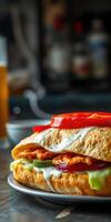 Delicious sandwich stacked with fresh ingredients served with a cold beverage in a cozy setting photo