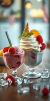 Delicious ice cream desserts served in elegant glasses with fresh raspberries and mint leaves photo