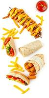 Delicious assortment of grilled skewers, wraps, and cheese sticks presented on a white background photo