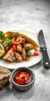 Juicy grilled chicken with fresh peppers and warm flatbread served with a side of spicy sauce photo