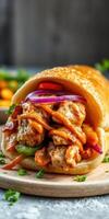 Delicious wrap filled with spiced chicken, fresh vegetables, and tangy sauce served on a wooden platter photo