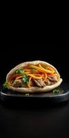 Delicious flatbread wrap filled with seasoned meat, vegetables, and fresh herbs on a dark background photo