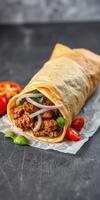Delicious wrap filled with spiced meat, fresh herbs, and vegetables served on a wooden table photo