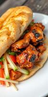 Delicious grilled chicken wrap with fresh vegetables served on a white plate in a cozy setting photo