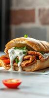 Delicious sandwich filled with spicy meat, fresh herbs, and creamy sauce on a rustic table photo