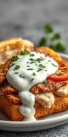 Delicious homemade sandwich with grilled chicken, fresh tomatoes, and creamy sauce photo