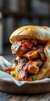 Delicious chicken sandwich with barbecue sauce and green onions on a wooden table photo
