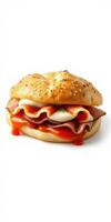 Savory bagel sandwich with layers of ham, cheese, and sauce on a sesame seed bagel photo