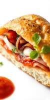 Delicious sandwich filled with savory meats, fresh vegetables, and herbs on a white background photo