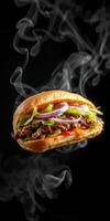 Delicious fresh sandwich with steaming ingredients served against a black background photo