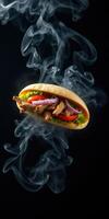 Delicious grilled chicken sandwich with fresh vegetables surrounded by smoke photo