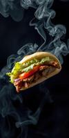 Delicious grilled sandwich with vegetables and smoke rising in a dark background photo