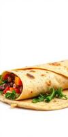 Delicious burrito filled with fresh vegetables and seasoned meat on a white background photo