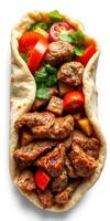Delicious wrap filled with seasoned meat, fresh vegetables, and herbs served in a flatbread photo