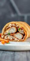 Delicious rolled wrap filled with savory chicken and creamy sauce served with crispy fries photo