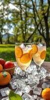 Refreshing summer drinks with citrus fruits on a sunny afternoon in a vibrant green park photo