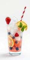 Refreshing summer beverage with fruits and ice, served in a tall glass with a striped straw photo
