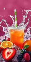 Colorful fruit drink splashes with ice against a vibrant pink background adorned with fruit photo