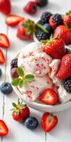 Delightful bowl of creamy ice cream topped with fresh strawberries, blueberries, and blackberries on a bright background photo
