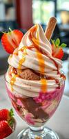 Delicious dessert featuring swirls of soft serve, chocolate, and strawberries in a glass photo