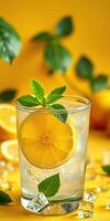 Refreshing citrus drink with lemon and mint served over ice in a vibrant setting photo