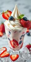 Delicious dessert with fresh strawberries and blueberries served in a glass cup topped with whipped cream photo
