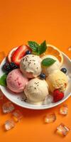 Colorful ice cream bowl with various flavors and fresh fruits on a vibrant orange background photo