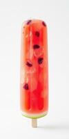 Refreshing watermelon popsicle with pomegranate seeds on a simple background photo