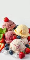 Colorful ice cream scoops arranged with fresh strawberries and blueberries on a chilled display photo