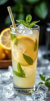 Refreshing lemonade with mint and lemon slices served in a tall glass photo