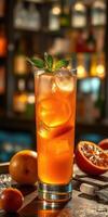Refreshing drink garnished with mint and fruits served at a lively bar in the evening photo