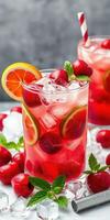 Refreshing cherry lemonade drinks with ice and citrus garnishes served at a summer gathering photo