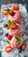 Delicious strawberry ice cream served on crushed ice with fresh mint and berries at a summer gathering photo