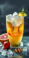 Refreshing cocktail garnished with citrus and mint served on a table with ice cubes and fruits photo