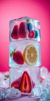 Creative arrangement of fruit inside ice cubes against a vibrant pink background photo