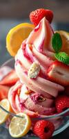 Delicious strawberry and lemon swirl ice cream topped with fresh fruit and mint leaves photo