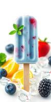 Delicious frozen fruit popsicle surrounded by fresh berries and citrus photo